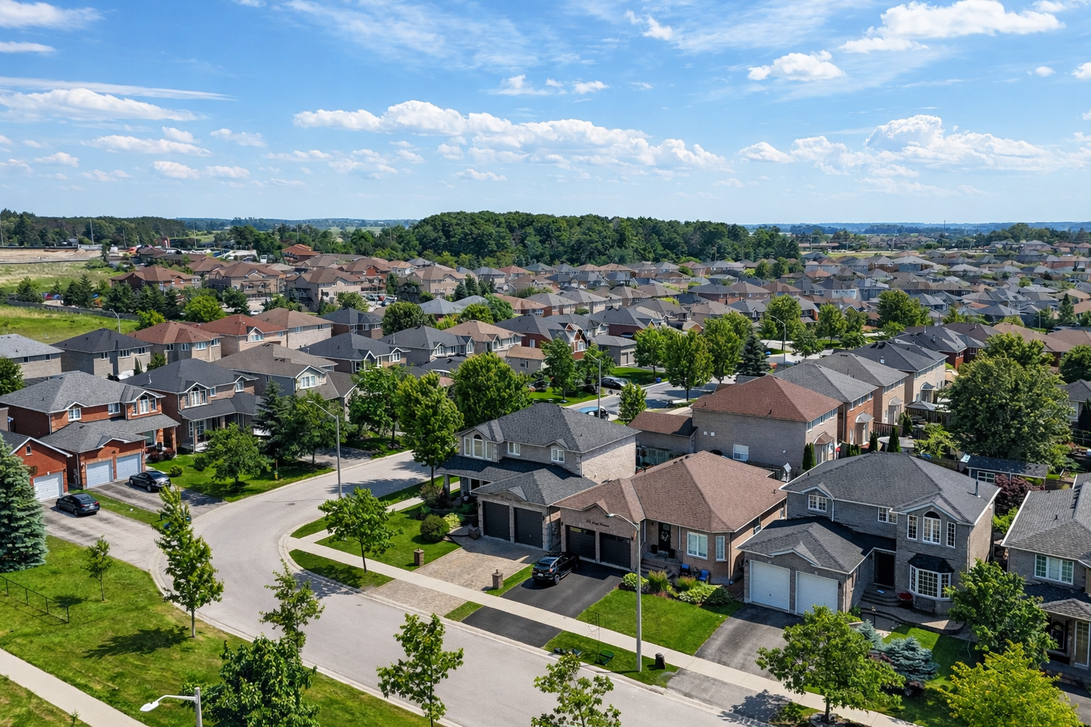 Aerial view of homes along a curved residential street